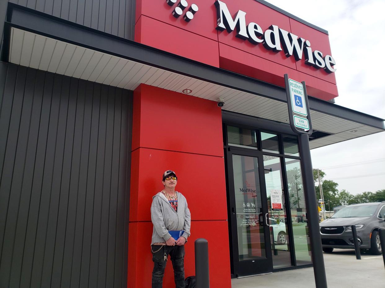 Billy Rohling stands outside a MedWise Urgent Care clinic in Tulsa, Oklahoma, where he came with his partner, who was having breathing problems. “They aren’t busy at all,” he said. MedWise was started in 2020 by QuikTrip, a gas station and convenience store chain.