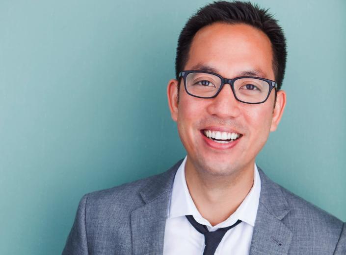 Eric Wu, a cofounder and CEO of Opendoor, posed for a photo on a blue background.