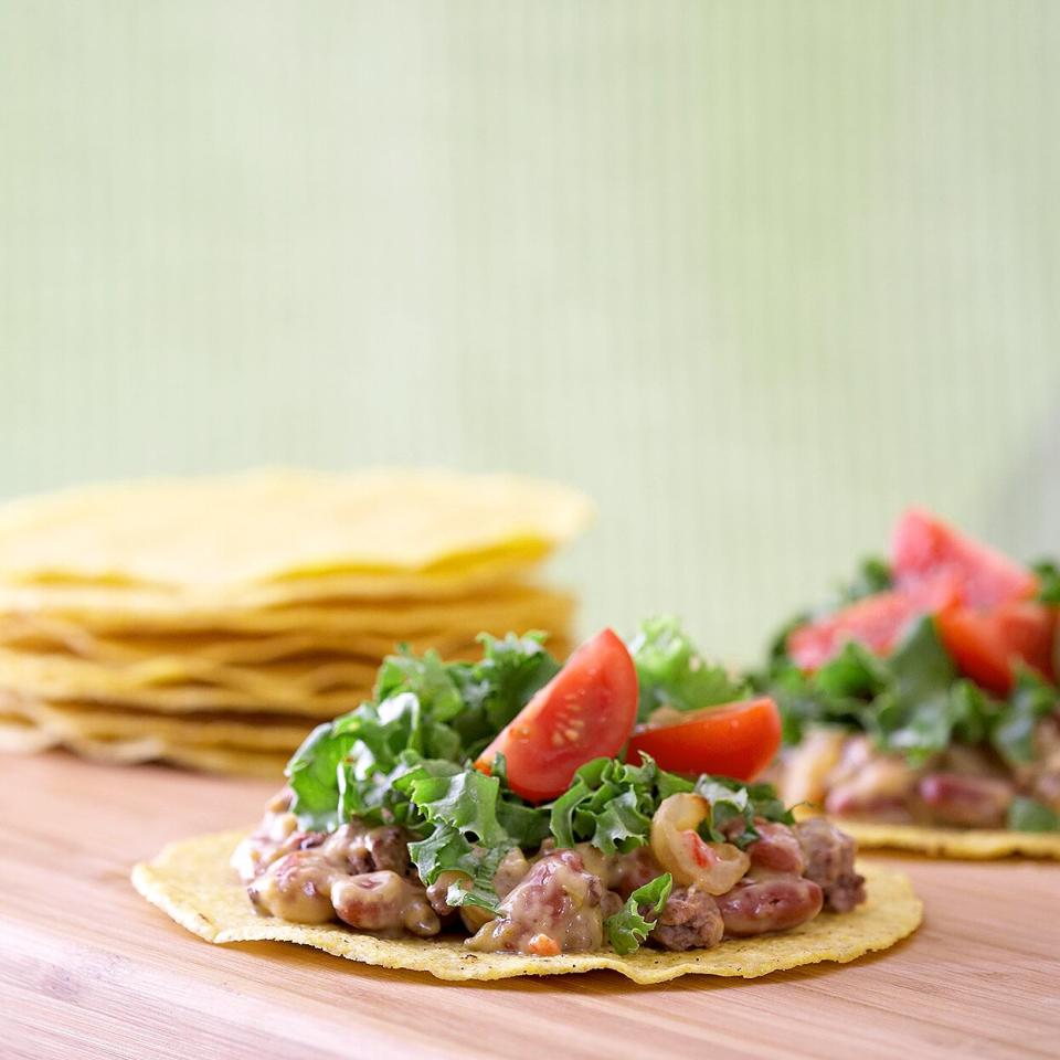 Corn tortillas are typically used in tostadas, which are simply open-faced tacos. You can find tostada shells in the grocery store, or you can create your own by crisping up corn tortillas in hot oil in a skillet.