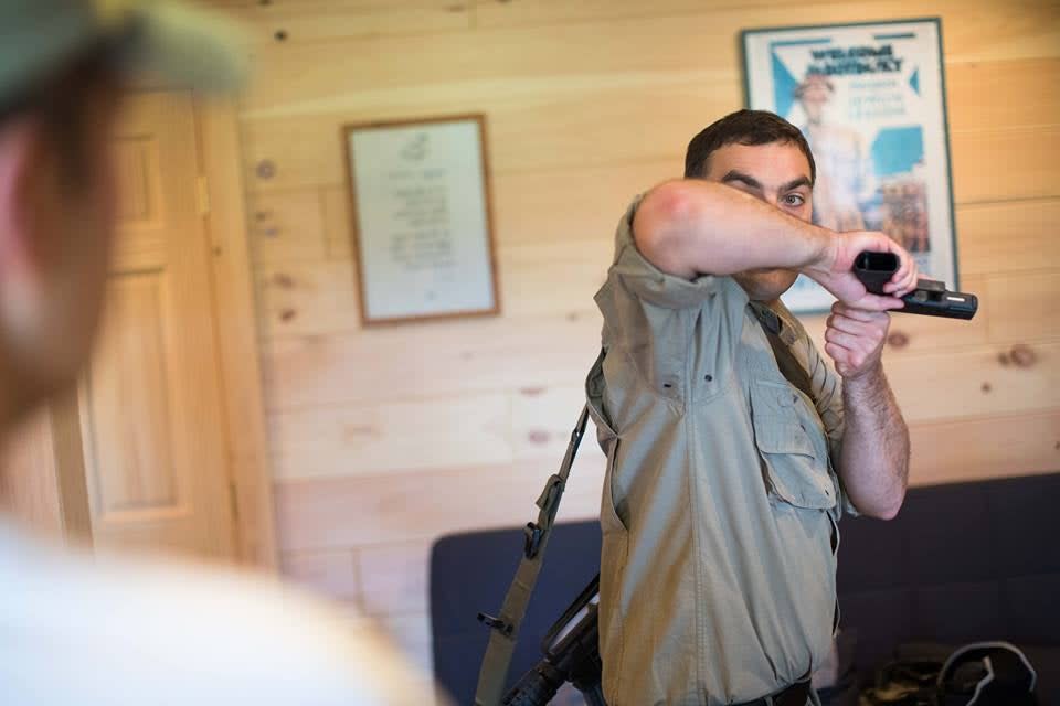 Israeli firearm instructor demonstrates techniques for Israeli carry.