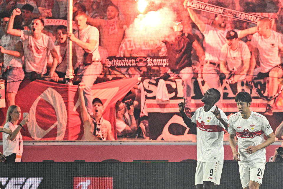 01 June 2023, Baden-Württemberg, Stuttgart: Soccer: Bundesliga - Relegation, VfB Stuttgart - Hamburger SV, Serhou Guirassy feiert mit Hiroki Ito (r) das 3:0.  Foto: Tom Weller/dpa (Photo by Tom Weller/picture alliance via Getty Images)