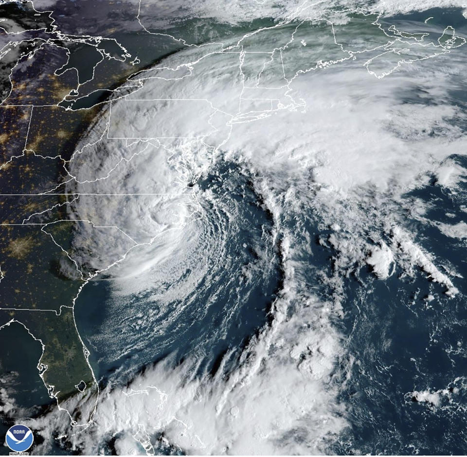 This Saturday, Sept. 23, 2023, 8:16 am EST satellite image provided by the National Oceanic and Atmospheric Administration shows Tropical Storm Ophelia making landfall in North Carolina. (NOAA via AP)