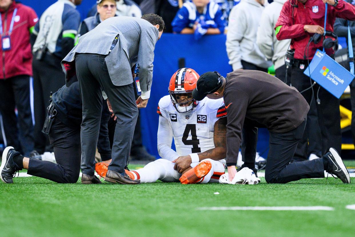Cleveland Browns quarterback Deshaun Watson (4) sits on the field after being injured Oct. 22 against the Indianapolis Colts in Indianapolis.