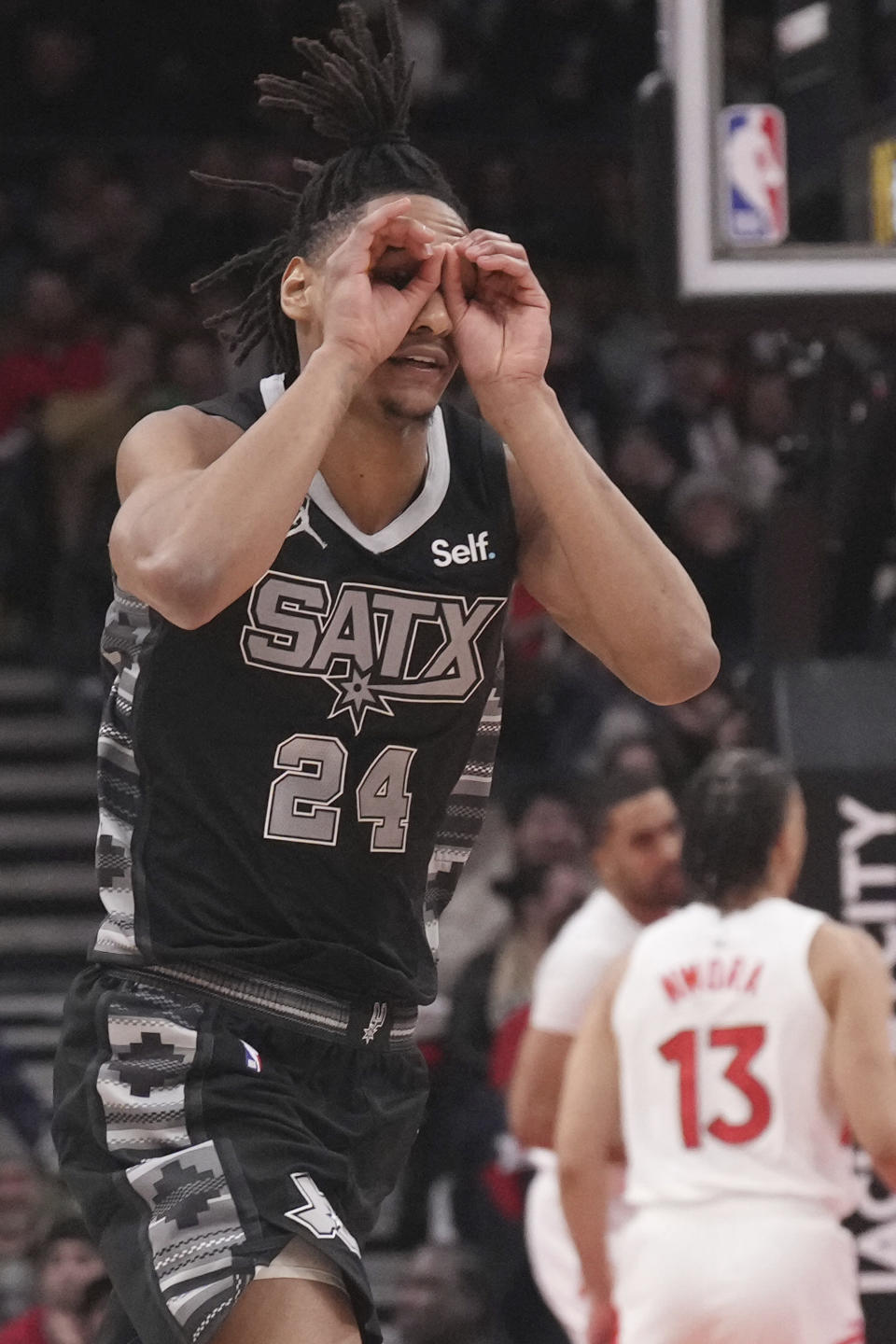 San Antonio Spurs' Devin Vassell celebrates after scoring against the Toronto Raptors during second-half NBA basketball game action in Toronto, Monday Feb. 12, 2024. (Chris Young/The Canadian Press via AP)