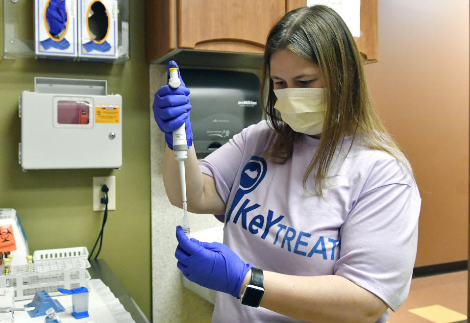 Ashley Holliday, senior medical assistant, prepares tests for hepatitis C and HIV in Hazard, Ky., Monday, Dec. 12, 2022. A study underway in the hard-hit corner of the state is exploring a simple way to get more people treated for hepatitis C. (AP Photo/Timothy D. Easley)