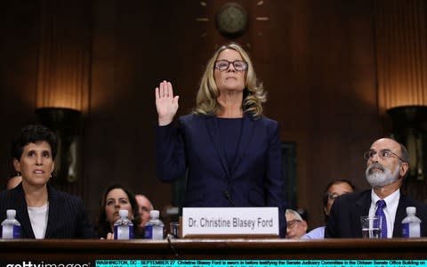 Christine Blasey Ford being sworn in before testifying the Senate Judiciary Committee in September - Credit: Win McNamee/Getty Images 