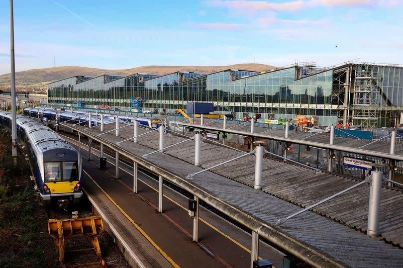 Trains arriving at the former Great Victoria Street Station, beside the new Belfast Grand Central Station.