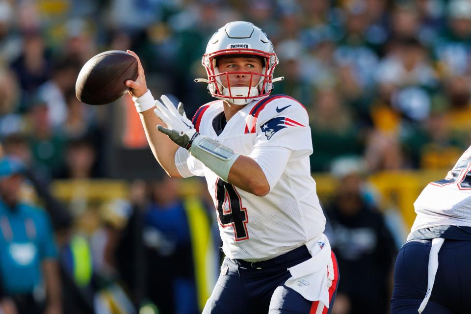 Oct 2, 2022; Green Bay, Wisconsin, USA;  New England Patriots quarterback Bailey Zappe (4) throws a pass during the second quarter against the Green Bay Packers at Lambeau Field. Mandatory Credit: Jeff Hanisch-USA TODAY Sports