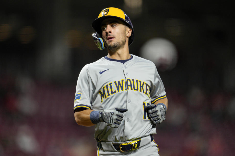 Milwaukee Brewers' Sal Frelick scores on a single by Blake Perkins against the Cincinnati Reds during the sixth inning of a baseball game Tuesday, April 9, 2024, in Cincinnati. (AP Photo/Jeff Dean)