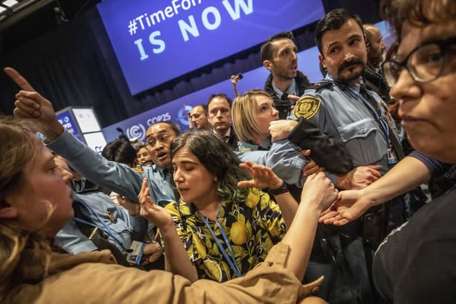 Demonstrators scuffle with UN security staff