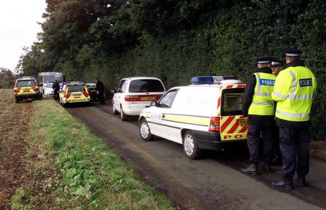 Police activity at the scene where Lin and Megan Russell were battered to death 