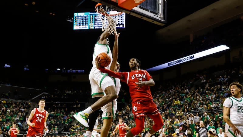 Utah guard Deivon Smith (5) shoots and misses against Oregon center N'Faly Dante (1) during the second half of an NCAA college basketball game in Eugene, Ore., Saturday, March 9, 2024. Oregon beat Utah 66-65.