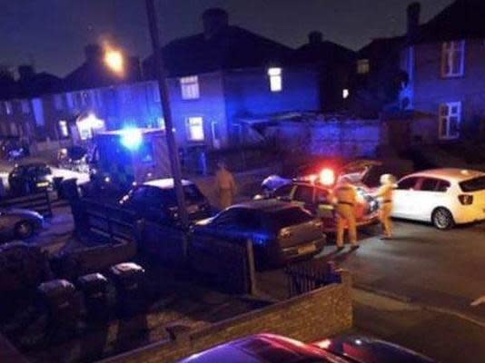 Police and paramedics attend the scene in Fraser Road, Edmonton: @999London