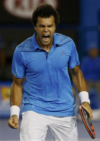 Jo-Wilfried Tsonga of France reacts during his men's singles match against Roger Federer of Switzerland at the Australian Open 2014 tennis tournament in Melbourne January 20, 2014. REUTERS/Bobby Yip