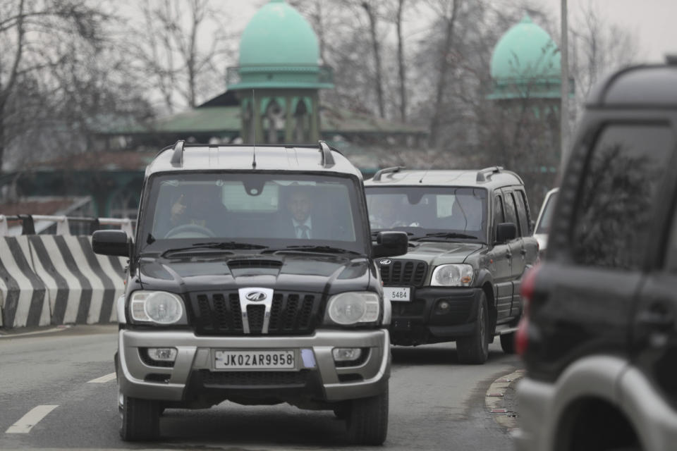 A convoy of New Delhi-based diplomats passes through Srinagar, Indian controlled Kashmir, Thursday, Jan. 9, 2020. Envoys from 15 countries including the United States are visiting Indian-controlled Kashmir starting Thursday for two days, the first by New Delhi-based diplomats since India stripped the region of its semi-autonomous status and imposed a harsh crackdown in early August. (AP Photo/Mukhtar Khan)