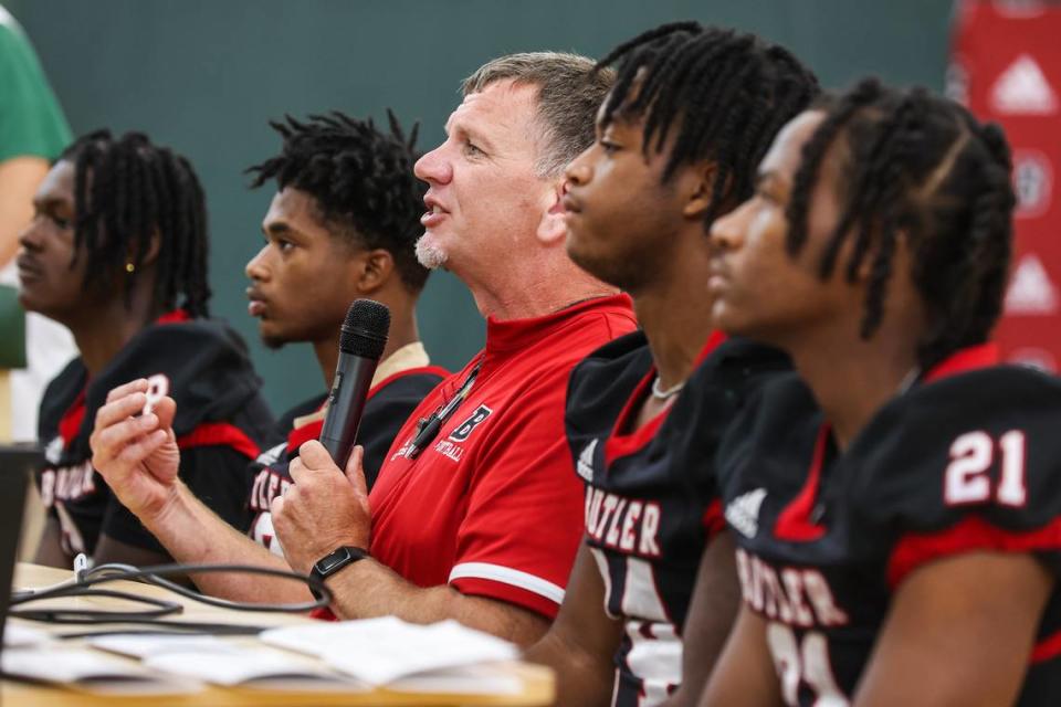 Head football coach for Butler High School, Brian Hales, center, answers questions during the Southwestern 4A conference media day on Thursday, July 28, 2022 in Charlotte, NC. Melissa Melvin-Rodriguez/mrodriguez@charlotteobserver.com