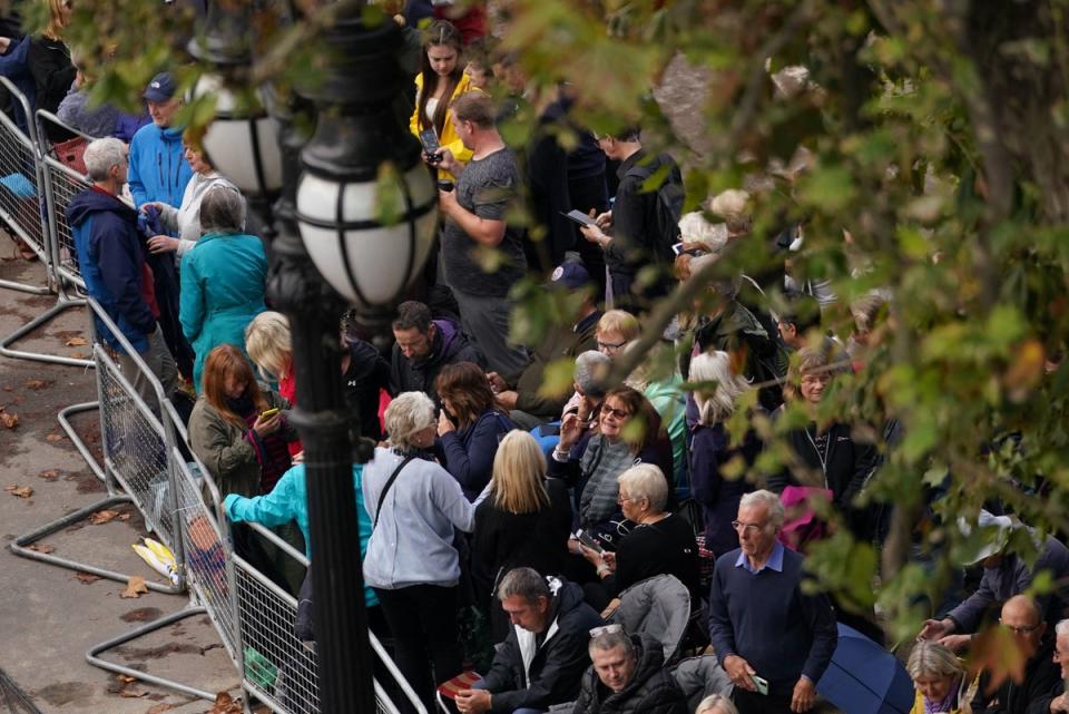 Crowds gather along The Mall ahead of the ceremonial procession of the coffin of Queen Elizabeth II from Buckingham Palace to Westminster Hall (PA)