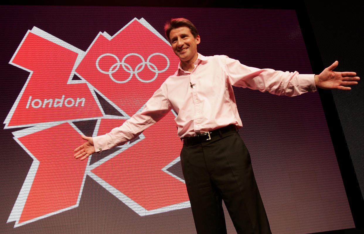 LONDON - JUNE 04:  Lord Sebastian Coe unveils the London 2012 Olympics emblem during the press launch of the 2012 Olympic and Paralympic brand and vision at the Roundhouse on June 4, 2007 in London, England. The new Olympic emblem is based on the number 2012, the year of the Games, and includes the Olympic Rings, one of the world's most recognised brands, and the word 'London', the world's most diverse city. The same 2012 images, with the Paralympic agitos, symbolises the Paralympic Games. (Photo by Daniel Berehulak/Getty Images)