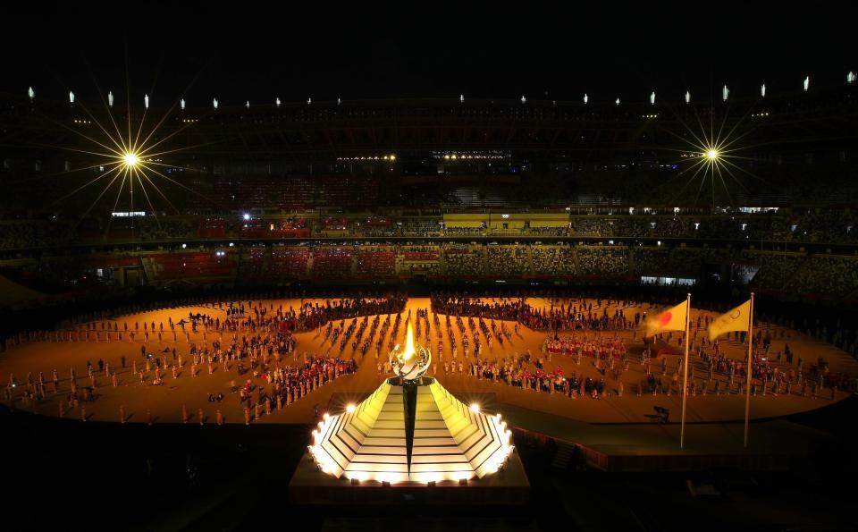 General view inside the stadium as Naomi Osaka of Team Japan lights the Olympic cauldron with the Olympic torch during the opening ceremony.