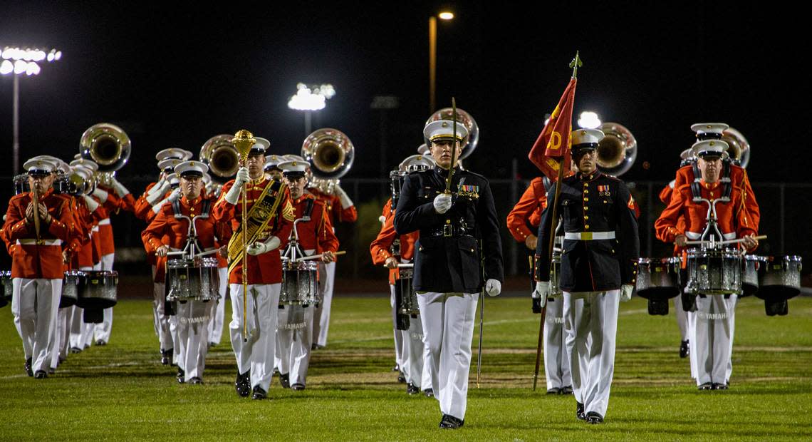 Marines with the Battle Color Detachment conduct “pass in review” during a Battle Color Ceremony at Kofa High School, Yuma, Ariz., March 3, 2022.