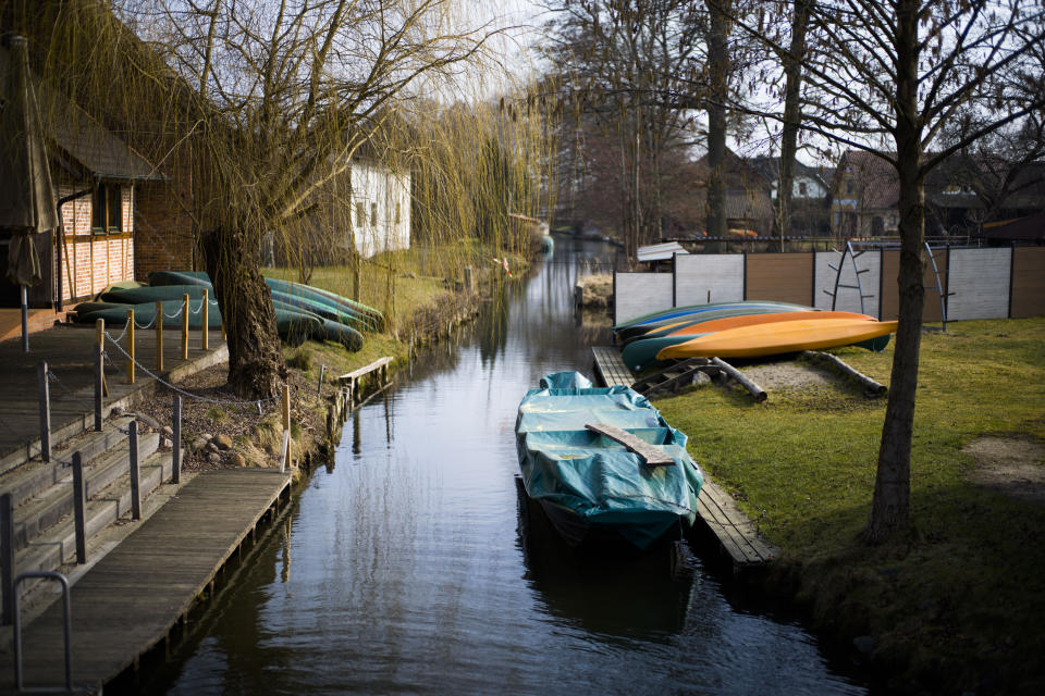 In this Thursday, Feb. 28, 2019 photo, a stream flows behind the buildings of German whiskey maker Spreewood Distillery through the village Schlepzig, Germany. (AP Photo/Markus Schreiber)