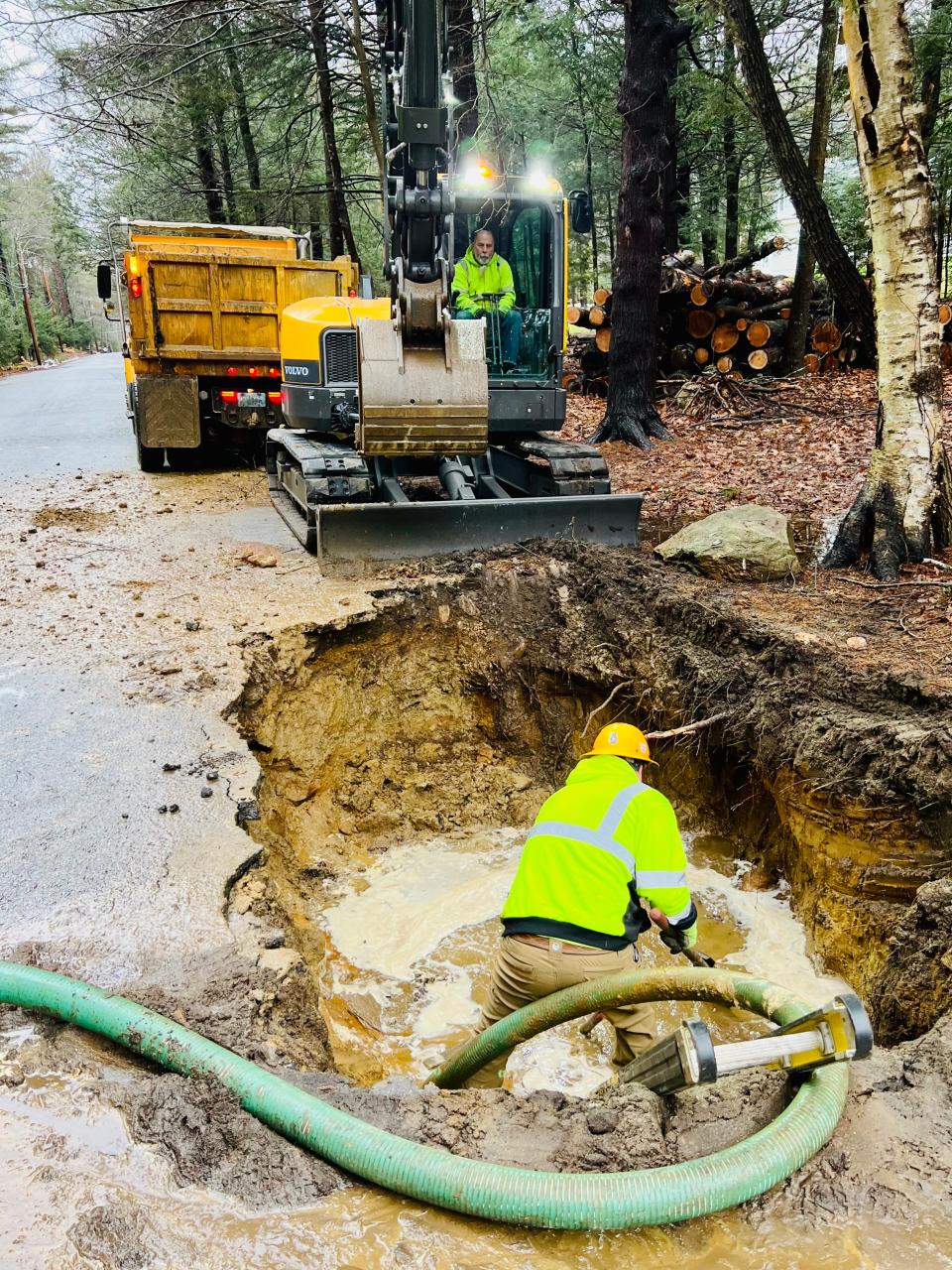 The Winchendon Department of Public Works crew repairs the broken water pipe under Sherbert Road on Thursday, Jan. 5.