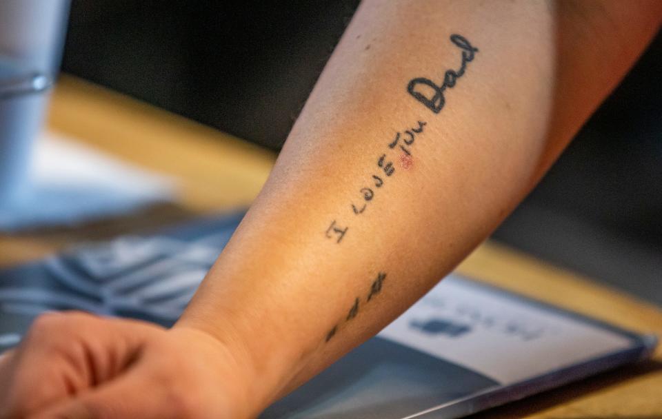 Owner Lise Gustavsen displays the tattoo on her arm that honors her father on Jan. 10, 2022, inside Gustavsen Cafe in Buchanan.