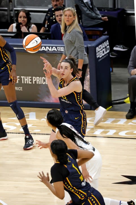 INDIANAPOLIS, IN – MAY 09: Indiana Fever guard Caitlin Clark (22) makes a pass on a fast break against the Atlanta Dream during a WNBA preseason game on May 9, 2024, at Gainbridge Fieldhouse in Indianapolis, Indiana. (Photo by Brian Spurlock/Icon Sportswire via Getty Images)
