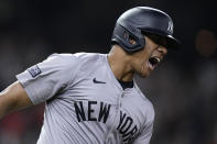 New York Yankees' Juan Soto celebrates after hitting a solo home run against the Houston Astros during the seventh inning of a baseball game Saturday, March 30, 2024, in Houston. (AP Photo/Kevin M. Cox)