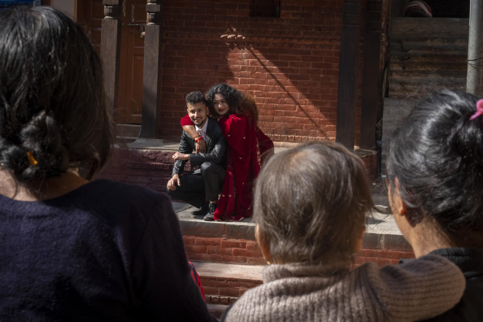 Same-sex couple Surendra Pandey, left, and Maya Gurung, who got married six years ago, sit for photographs during a press meet in Kathmandu, Nepal, Friday, Dec. 1, 2023. The gay couple in Nepal on Wednesday , Nov. 29, became the first in the nation to receive official same-sex marriage status. (AP Photo/Niranjan Shrestha)