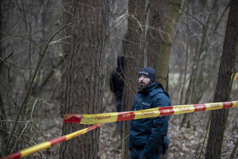 Police officers inspect the territory near the house of Leonid Volkov, a close associate of the late Russian opposition leader Alexei Navalny, in Vilnius, Lithuania, Wednesday, March 13, 2024. Volkov on Wednesday blamed the government of Russian President Vladimir Putin after he was attacked with a hammer and tear gas outside his home near the Lithuanian capital, where he lives in exile, the late Navalny's anti-corruption foundation said.(AP Photo/Mindaugas Kulbis)