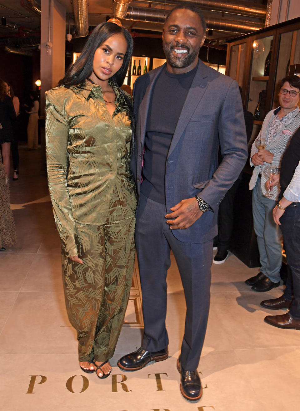 <p>Idris Elba and Sabrina Dhowre continue their stylish week out on Oct. 8 for the launch of the actor's new Port Noire Bar and Shop, in partnership with David Farber, in London's Coal Drops Yard.</p>