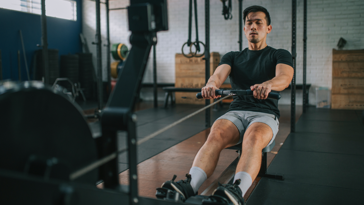  Man on a rowing machine. 