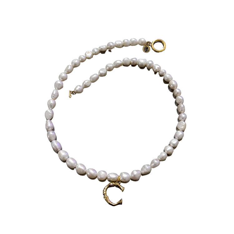 <p><a href="https://www.onlymade.co/shop/p/pearl-initial-necklace" rel="nofollow noopener" target="_blank" data-ylk="slk:Shop Now;elm:context_link;itc:0;sec:content-canvas" class="link ">Shop Now</a></p><p>Pearl Initial Necklace</p><p>$95.00</p><p>onlymade.co</p>