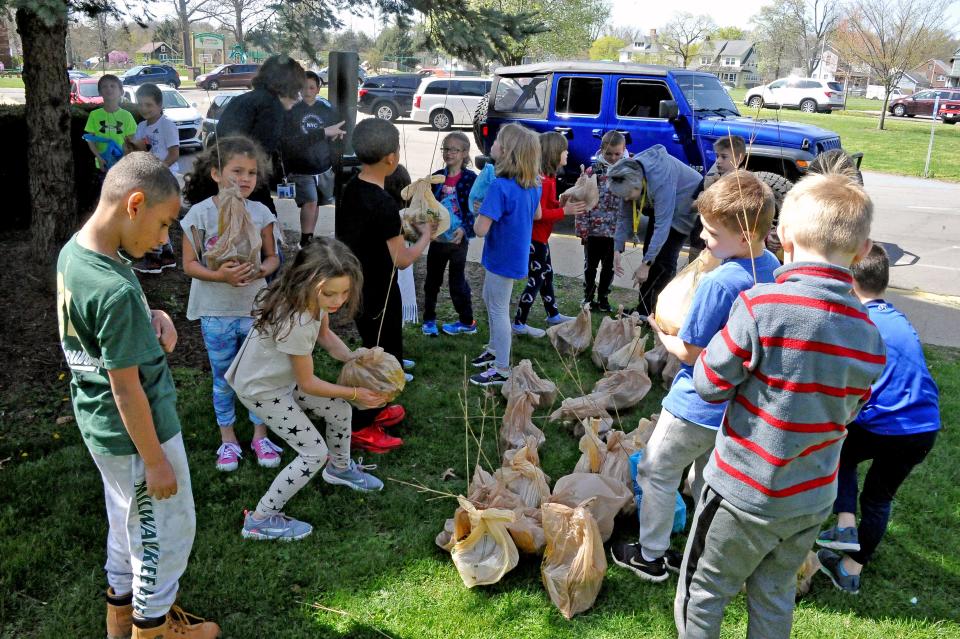 At the end of the day, students in Joni Hiller's first grade class picked out their very own dogwood tree to take home and plant.