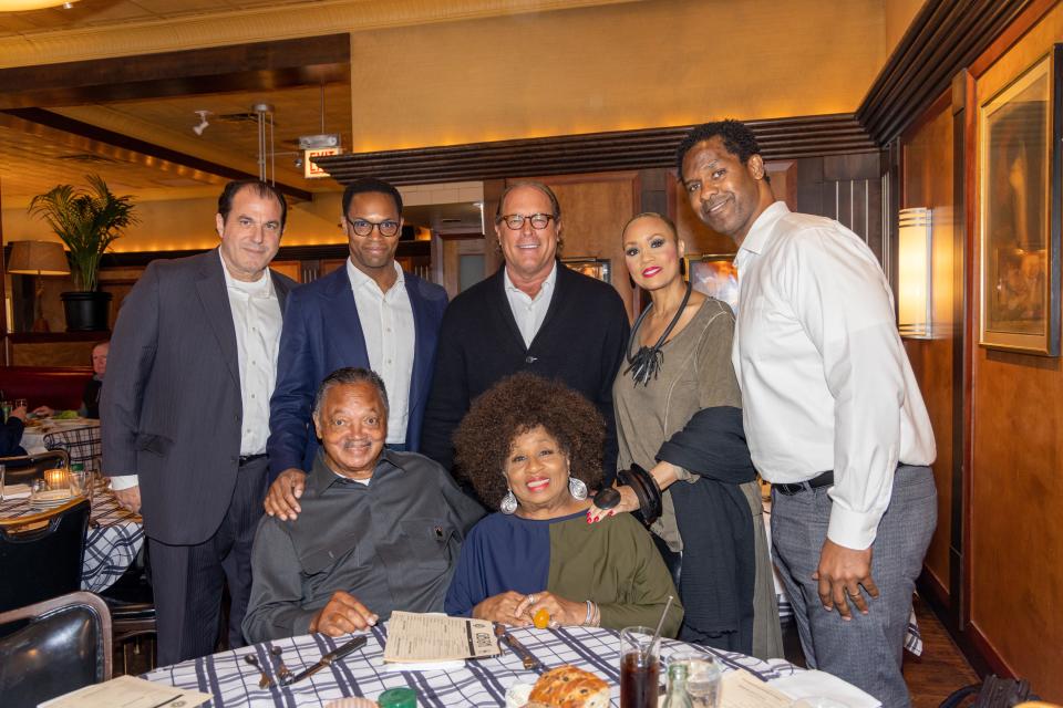 Jesse Jackson at Gibson steak house in Chicago with Michael Linowes, Steve Mosko, William Keys and the Jackson Family. [Back L-R Michael Linowes, Yusef Jackson, Steve Mosko, Santita Jackson, William Keys; Front L-R Rev. Jackson, Mrs. Jackson] - Credit: Stephen Green