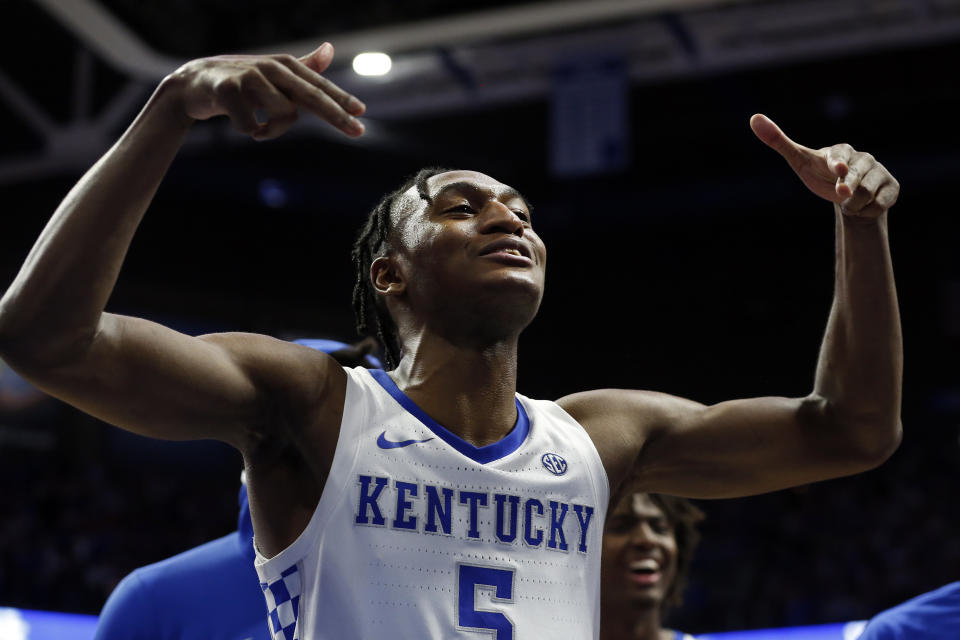 Kentucky's Immanuel Quickley celebrates after an overtime win against Louisville in an NCAA college basketball game in Lexington, Ky., Saturday, Dec. 28, 2019. (AP Photo/James Crisp)
