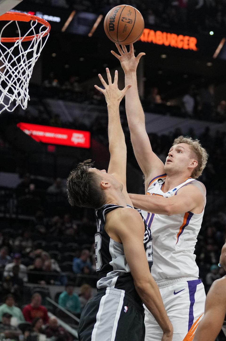 Dec 4, 2022; San Antonio, Texas, USA;  Phoenix Suns center Jock Landale (11) shoots over San Antonio Spurs forward Zach Collins (23) in the first half at the AT&T Center. Mandatory Credit: Daniel Dunn-USA TODAY Sports