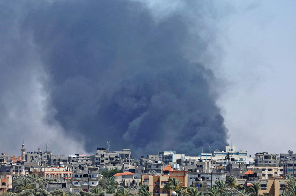 Smoke rises from an Israeli air strike in Rafah on May 24, 2024.  (Mohammed Salem / Reuters)