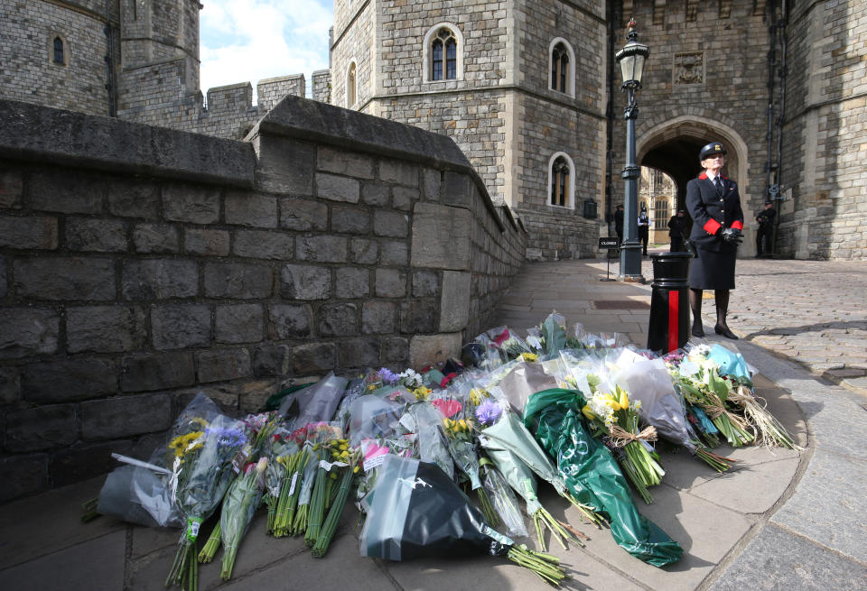 Flowers left outside Windsor Castle, Berkshire, following the announcement of the death of the Duke of Edinburgh at the age of 99. Picture date: Friday April 9, 2021. (Photo by Jonathan Brady/PA Images via Getty Images)