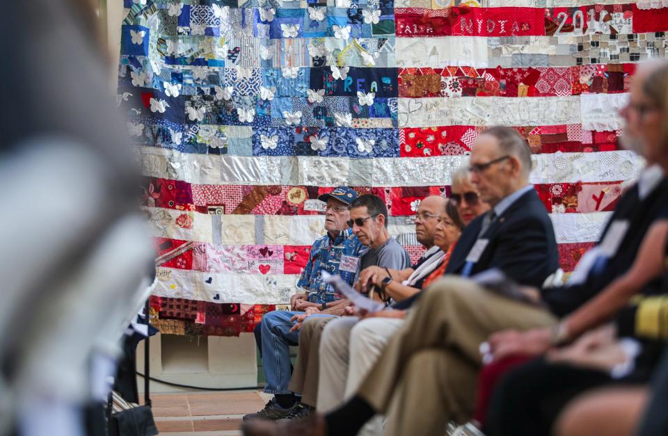 U.S. Navy veteran Robert Wayman sits along with other veterans during the annual Veterans Day recognition ceremony at city hall, Thursday, Nov. 11, 2021, in La Quinta, Calif. 