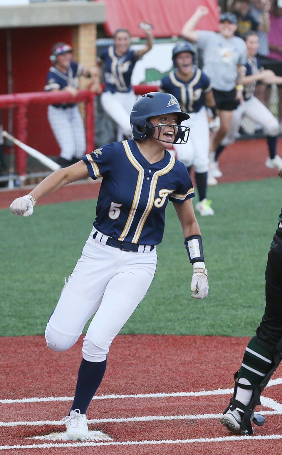 Tallmadge's Leila Staszak reacts as she scores the game winning run on a single in the seventh inning against Greenville in the Div. II state semifinal softball at Firestone Stadium in Akron.