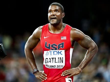 Justin Gatlin from the U.S. reacts after the men's 100m final during the 15th IAAF World Championships at the National Stadium in Beijing, China August 23, 2015. REUTERS/Lucy Nicholson