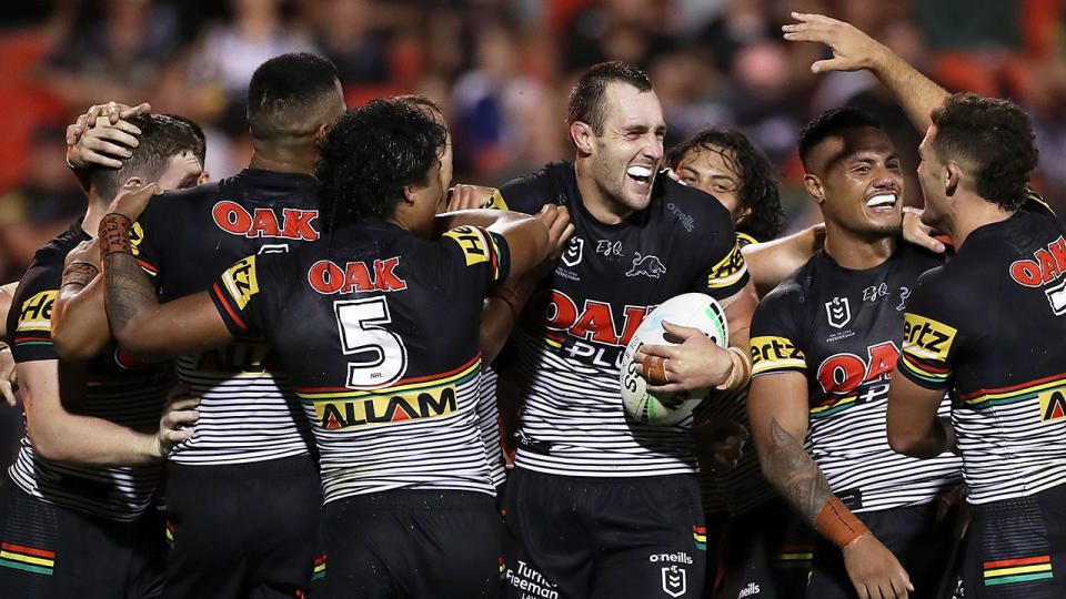 Pictured here, the Penrith Panthers celebrate during their big win over the Cowboys. 