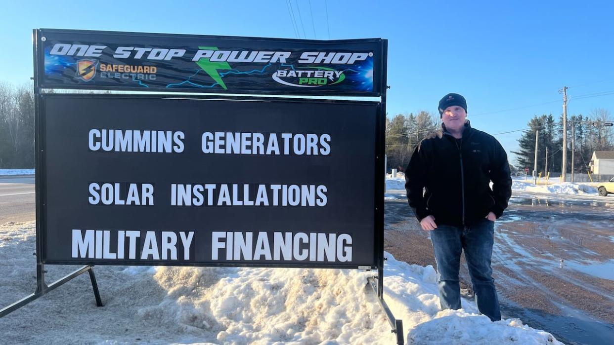 Kevin Holm, owner of Safeguard Electric, is choosing to keep up the portable sign in front of his business despite getting fined by the town of Petawawa, Ont. (Submitted by Kevin Holm - image credit)