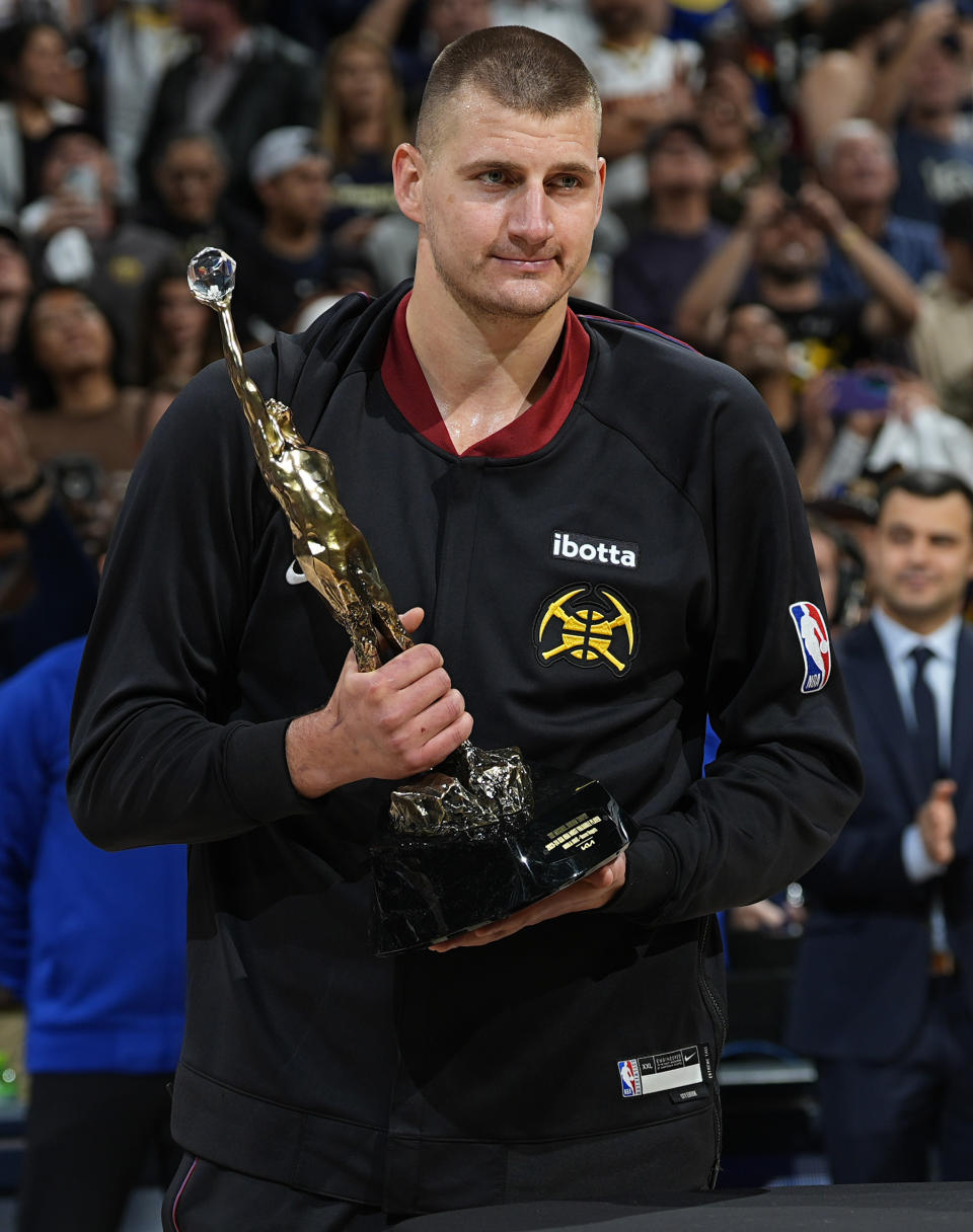 Denver Nuggets center Nikola Jokic holds his NBA basketball MVP trophy before Game 5 of the team's second-round playoff series against the Minnesota Timberwolves on Tuesday, May 14, 2024, in Denver (AP Photo/David Zalubowski)