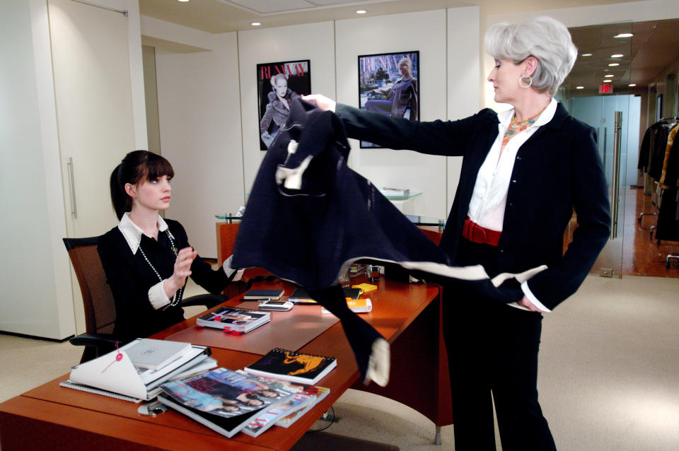 Miranda Priestly throws a jacket to Andy Sachs in 'The Devil Wears Prada'