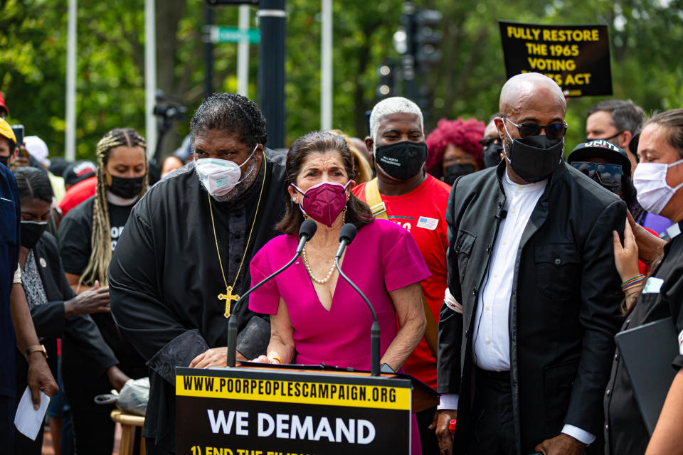 WASHINGTON DC — Luci Baines Johnson stands with Reverend Doctor William Barber at a rally this week in D.C., where protestors urged the US Senate to end the filibuster, protect voting rights, and raise the federal minimum wage to $15 an hour.  / Credit: Michael Nigro/Pacific Press/LightRocket via Getty Images