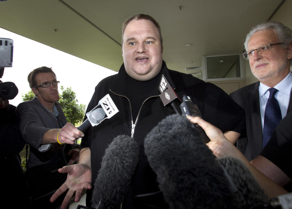 FILE - In this Feb. 22, 2012 file photo, Kim Dotcom, the founder of the file-sharing website Megaupload, comments after he was granted bail and released in Auckland, New Zealand. On his way up, he fooled them all: journalists, judges, investors and companies. Then the man who renamed himself Kim Dotcom finally did it. With an eye for get-rich schemes and an ego gone wild, he parlayed his modest computing skills into a mega-empire, becoming the fabulously wealthy computer maverick he had long claimed to be. (AP Photo/New Zealand Herald, Brett Phibbs, File) NEW ZEALAND OUT, AUSTRALIA OUT