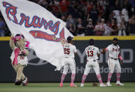 Atlanta Braves outfielders Cristian Pache (25), Ronald Acuna Jr. (13) and Marcell Ozuna, right, celebrate the team's 6-1 victory over the Philadelphia Phillies at the end of a baseball game Sunday, May 9, 2021, in Atlanta. (AP Photo/Ben Margot)